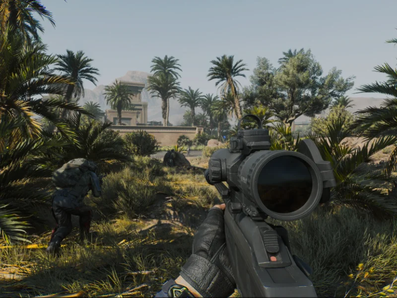 Delta Force Injector First-person shooter view of a soldier aiming a rifle in a tropical combat zone with palm trees and ancient ruins.
